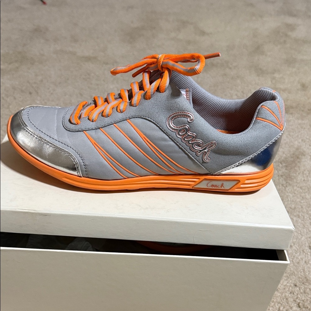 Coach women’s Silver and Orange Sneakers